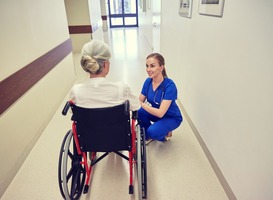 Normal_nurse-with-senior-woman-in-wheelchair-at-hospital-2022-12-16-09-49-56-utc__1_
