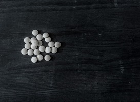 Normal_top-view-of-mdma-pills-on-black-wooden-surface-2022-11-18-00-34-50-utc__1_