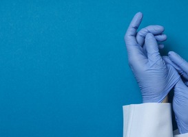 Normal_doctor-hands-in-medical-gloves-on-blue-background-2021-09-02-05-11-20-utc__1_