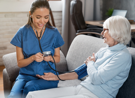 Normal_female-nurse-checking-blood-pressure-of-senior-wom-2022-05-31-02-21-30-utc