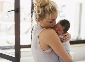 Normal_mother-holding-her-crying-baby-close-to-her-should-2022-03-08-01-24-33-utc-min__1_