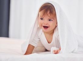 Normal_with-white-towel-cute-little-baby-is-indoors-in-t-2022-02-03-21-06-52-utc