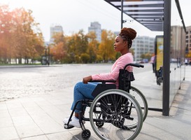 Normal_black-paraplegic-woman-in-wheelchair-waiting-on-bu-2023-11-27-05-04-26-utc__1_