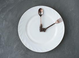 Normal_lunch-time-concept-spoon-and-a-fork-on-a-plate-2023-11-27-04-58-09-utc__1_